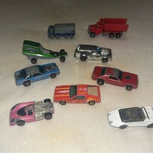 This is a lot of 9 Hot Wheels  The lot includes parts and repair pieces